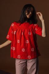 Front view studio photo highlighting the generous gathers under the front yoke seam and easy drape of the Claire Blouse.