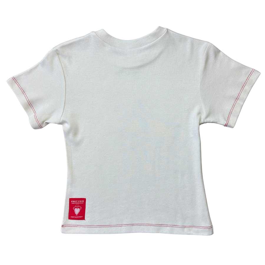 Back view of Fruit Face I Love NY baby tee in cream with red stitching
