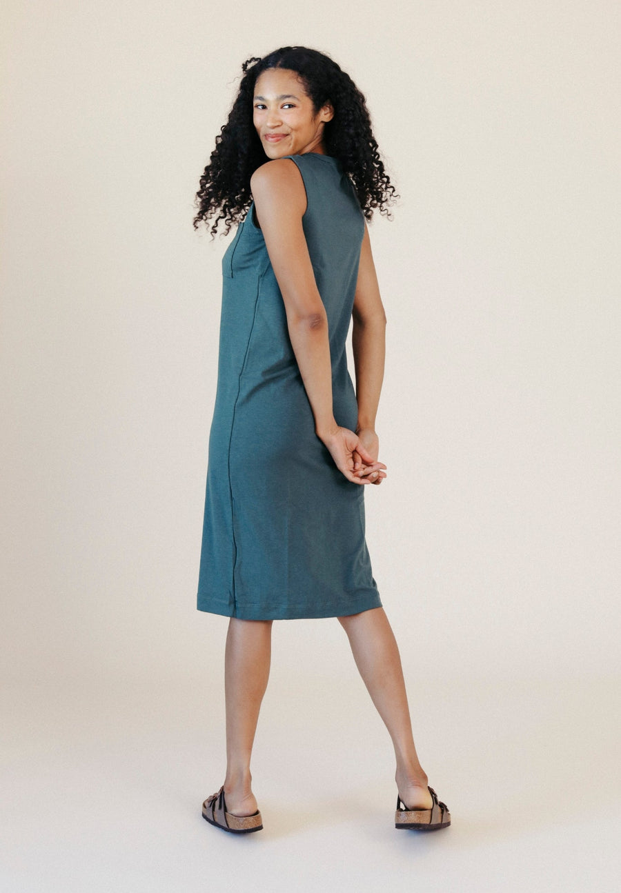 Three-quarter back perspective view highlighting the comfortable jersey drape of the Sophie Tank Dress.