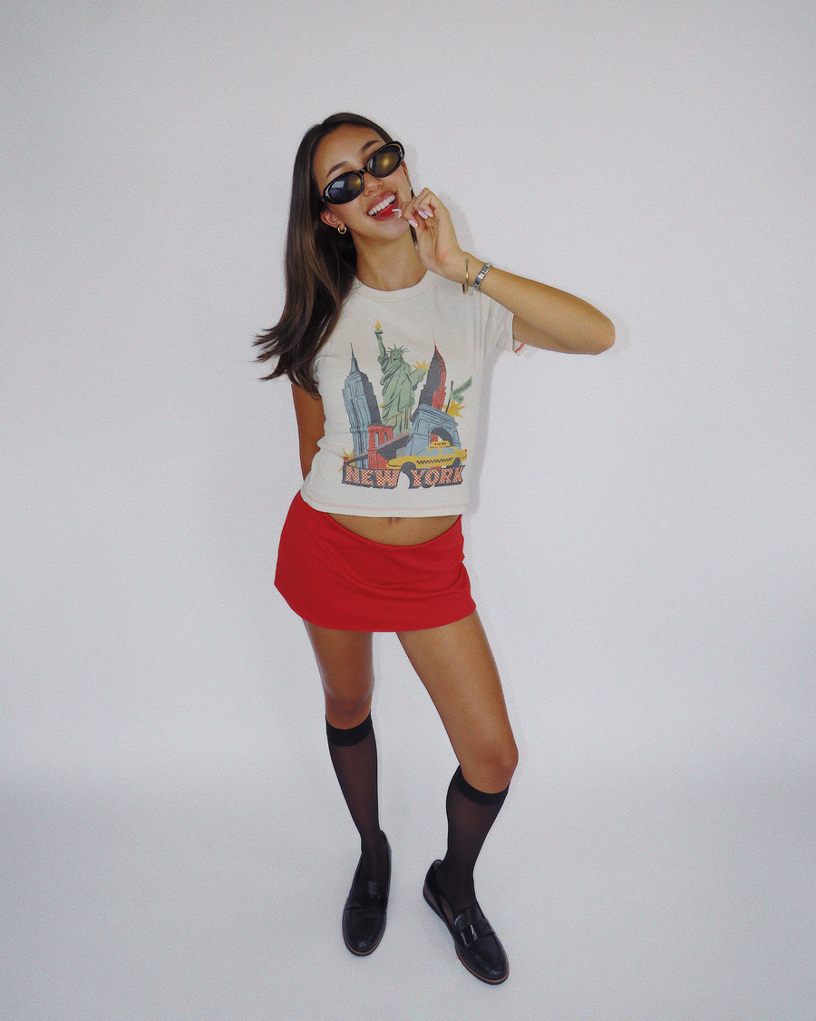Model wearing Fruit Face NYC baby tee with New York graphic