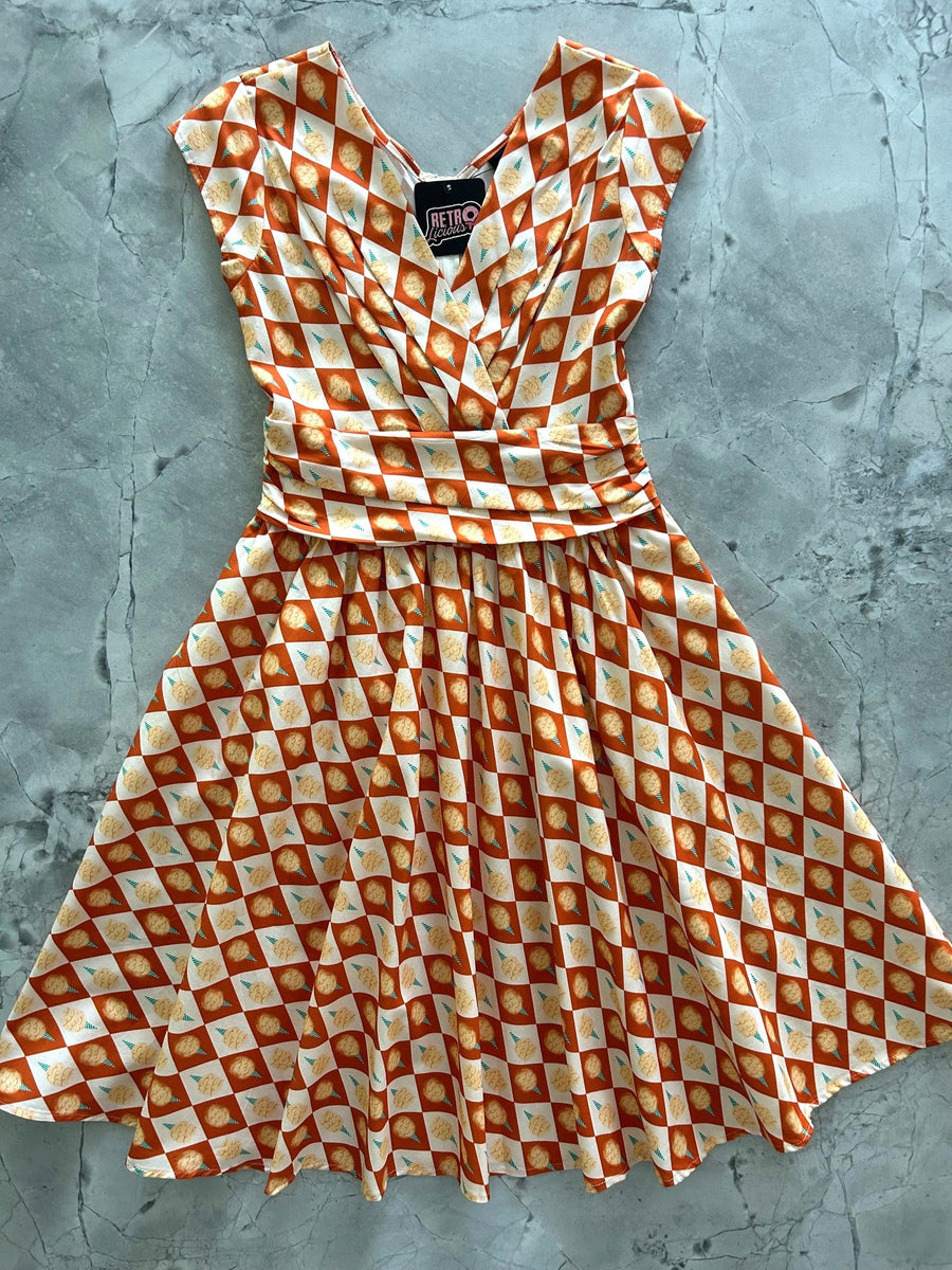 Studio flat lay photo of the Retrolicious Cotton Candy Greta Dress highlighting the surplice V-neck bodice and gathered waist.