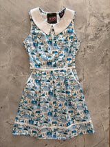 Flat lay product view of the Retrolicious Santorini Collared Dress on a gray marble background showing the full A-line skirt and white collar.