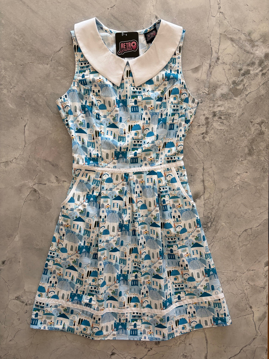 Flat lay product view of the Retrolicious Santorini Collared Dress on a gray marble background showing the full A-line skirt and white collar.