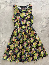 Flat lay photo of the Retrolicious Wine Vintage Dress showing its fitted bodice, sleeveless armholes, and full pleated skirt.