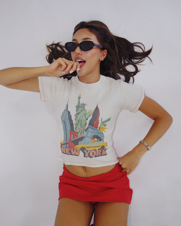 Model wearing Fruit Face New York City graphic baby tee