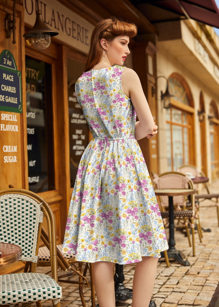 Back view of the Retrolicious Wildflower vintage dress showing the sleeveless cut, fitted waist, and full flared knee-length skirt.