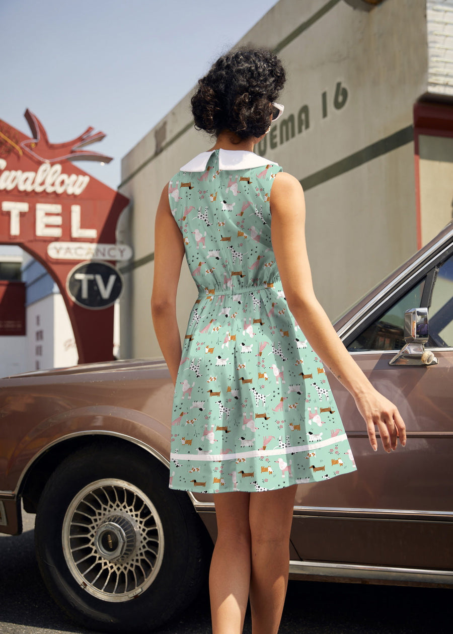 Back view of the Retrolicious Dogs Collared Dress showing the sleeveless 60s mod silhouette and white Peter Pan collar trim.
