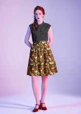 Full-length studio view of model wearing the Cats & Pumpkins A-line Skirt with red heels.