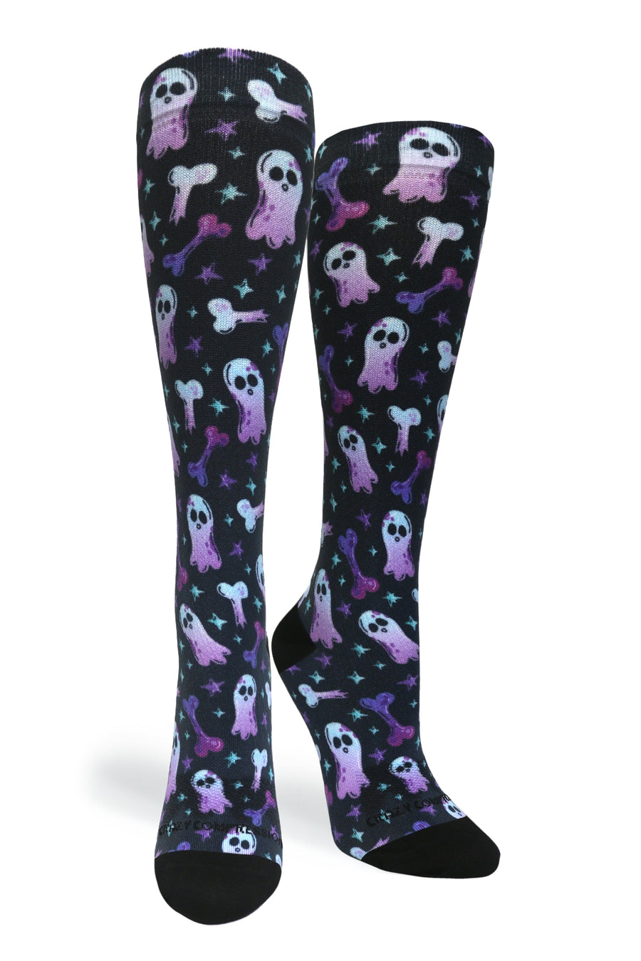 Studio shot of a pair of Crazy Compression Haunting Bones knee-high socks showing purple and blue ghost and bone graphics on black fabric.
