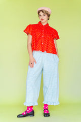 Light blue bleached floral jacquard chambray pants with a whimsical ruffle hem and side pockets. Whimsical, size-inclusive cotton loungewear by Nettle Studios.