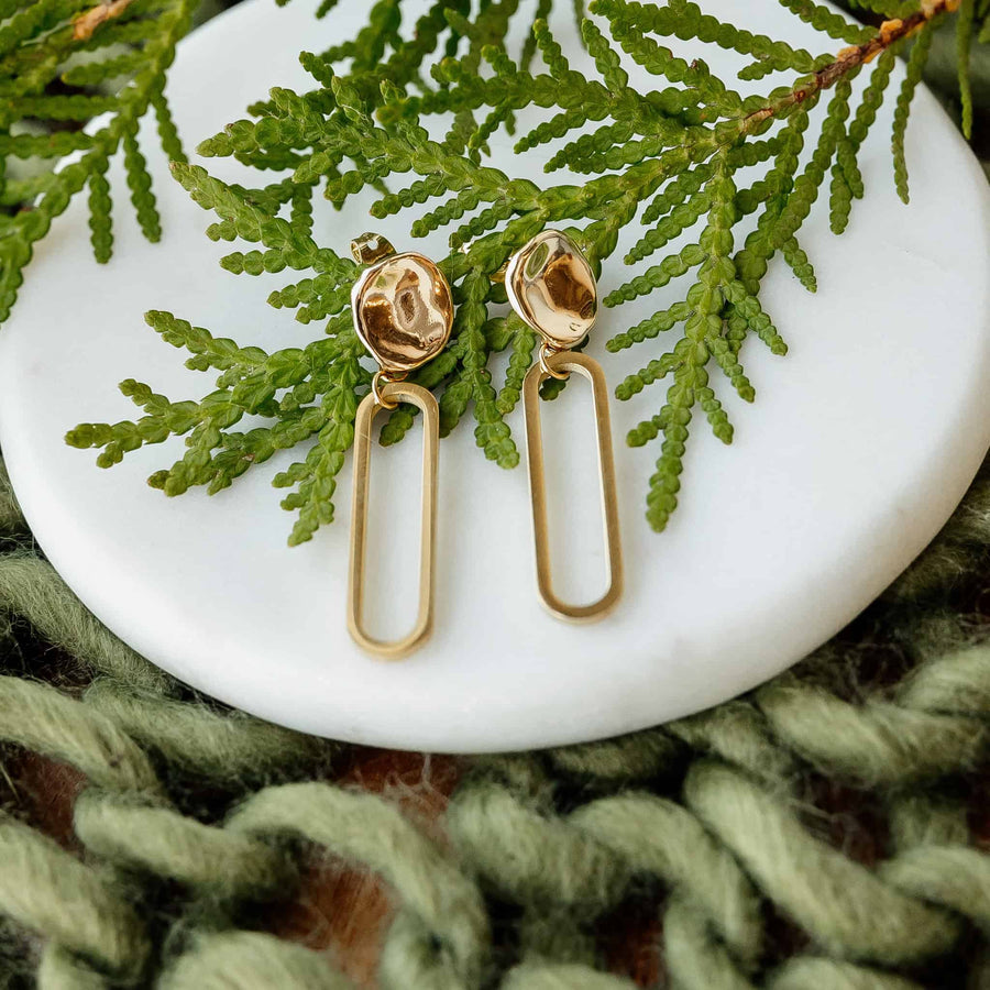 Ethically made 14k gold-plated Cleo geometric drop earrings by Sela Designs.