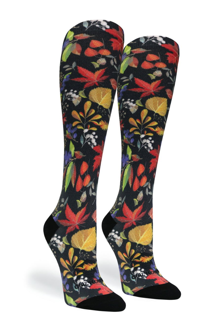 Front angle view of the pair of Falls Back compression socks showing the colorful fall foliage knit design.