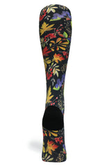 Back view showing the black reinforced heel and continuous fall leaf pattern on the sock calf.