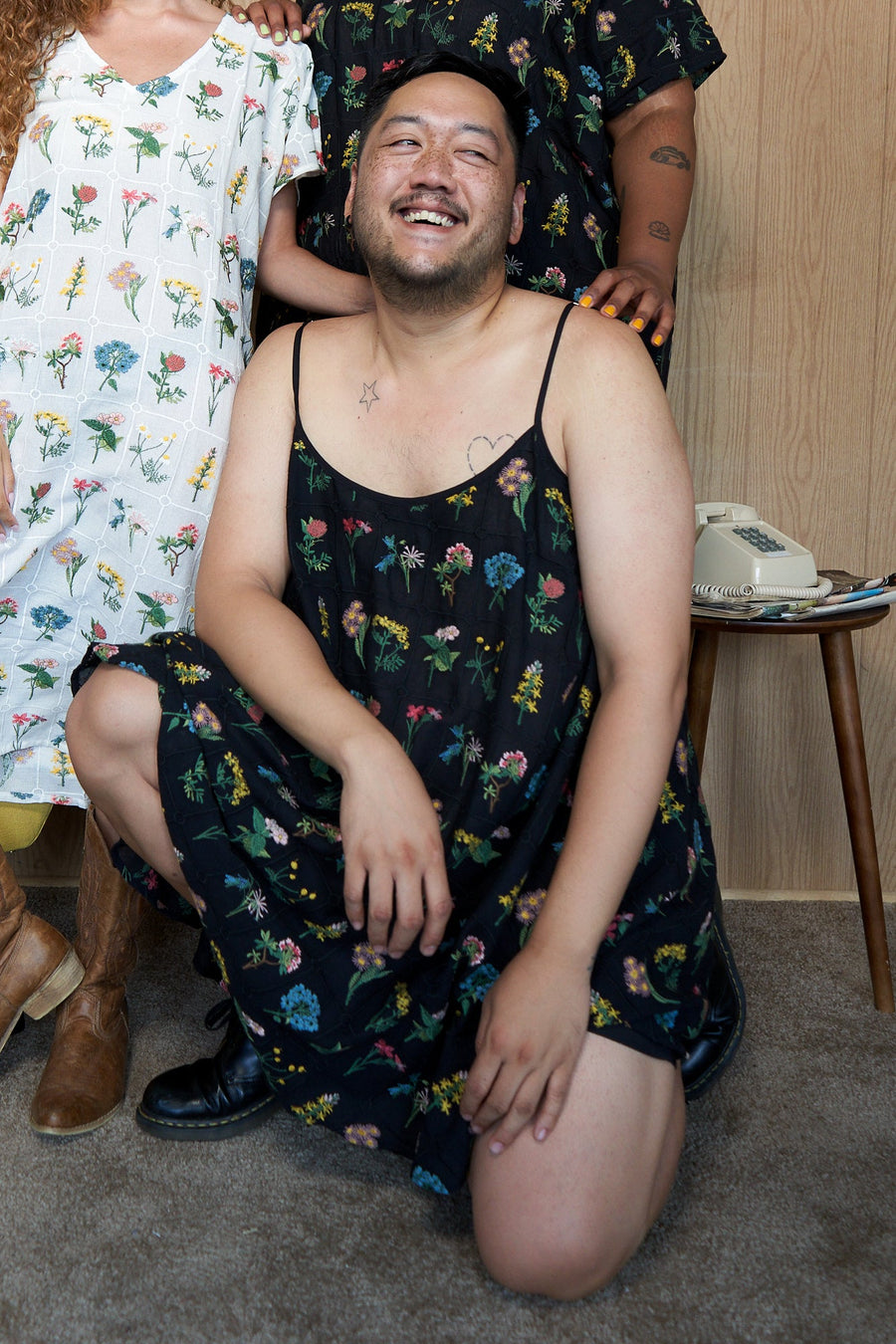 Plus size model wearing the Tamara Malas Gigi Slip Dress in black floral print.