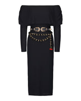 Studio product shot of the black geometric knit cowl neck midi dress displayed flat with both its western double-buckle belt and red cherry charm chain belt styled at the waist.