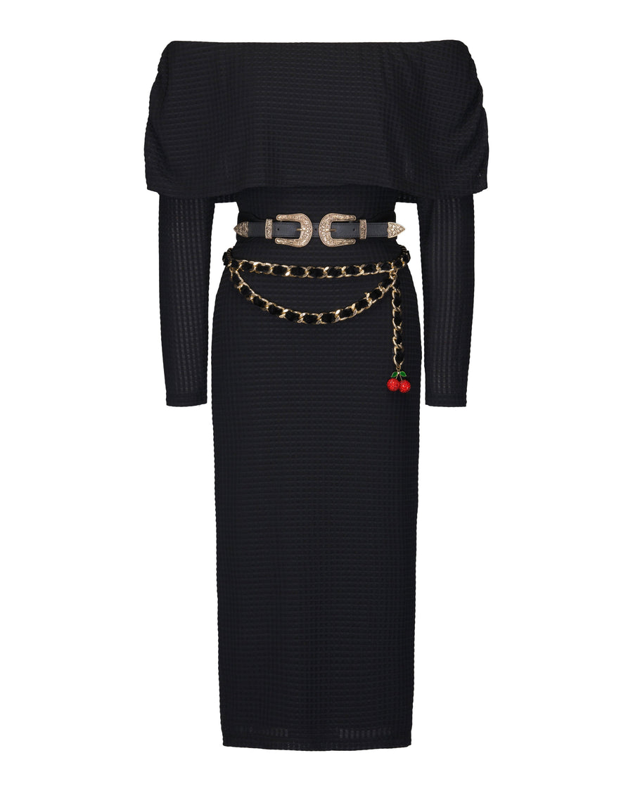 Studio product shot of the black geometric knit cowl neck midi dress displayed flat with both its western double-buckle belt and red cherry charm chain belt styled at the waist.
