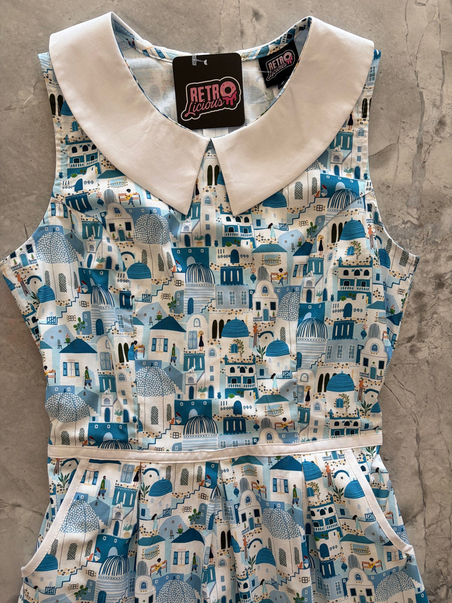 Flat lay detail of the Retrolicious Santorini dress bodice featuring the white contrast Peter Pan collar, waist piping trim, and brand tag.