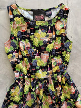 Close-up flat lay shot focusing on the high neckline and bodice construction of the Retrolicious Wine print dress.