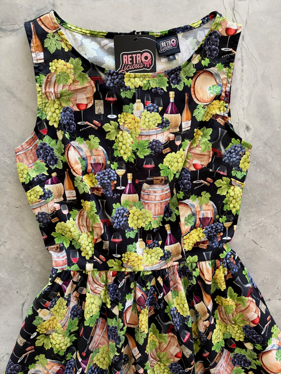 Close-up flat lay shot focusing on the high neckline and bodice construction of the Retrolicious Wine print dress.