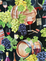High-resolution detail shot of the 100% cotton fabric showing the wine bottle, oak barrel, wine glass, and green grape print.