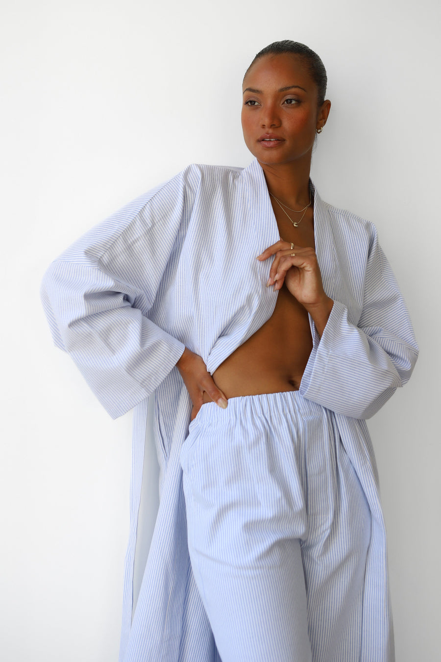 Mid-section view highlighting the high-waisted elastic band and traditional boxer front of the Be Idle Pinstripe Boxer Pant in Sky. Comfortable, size-inclusive everyday loungewear style.
