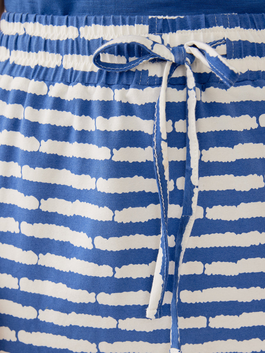 Close-up front view of the cobalt blue striped organic cotton drawstring midi skirt.