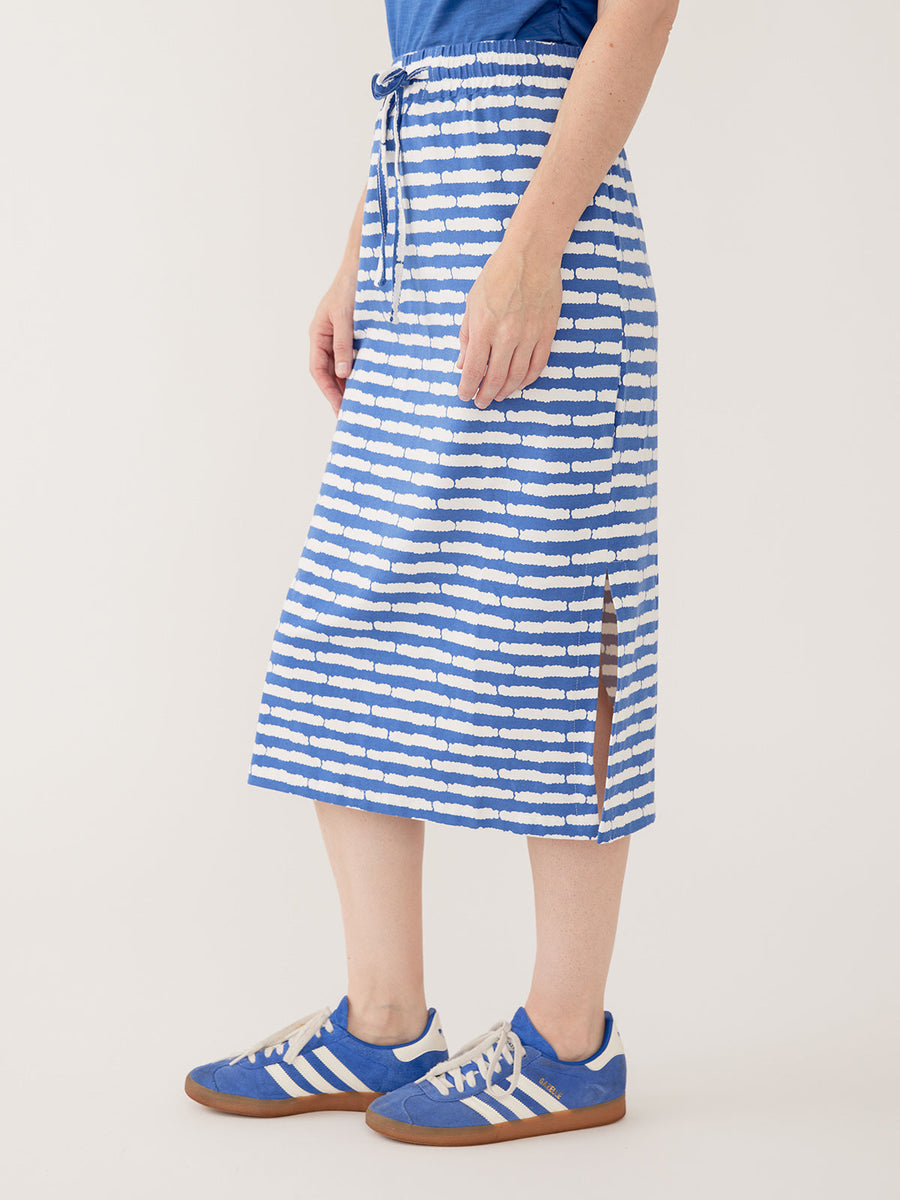 Side view of the Mata Traders Isla striped midi skirt showing the relaxed straight fit and side hem slit.