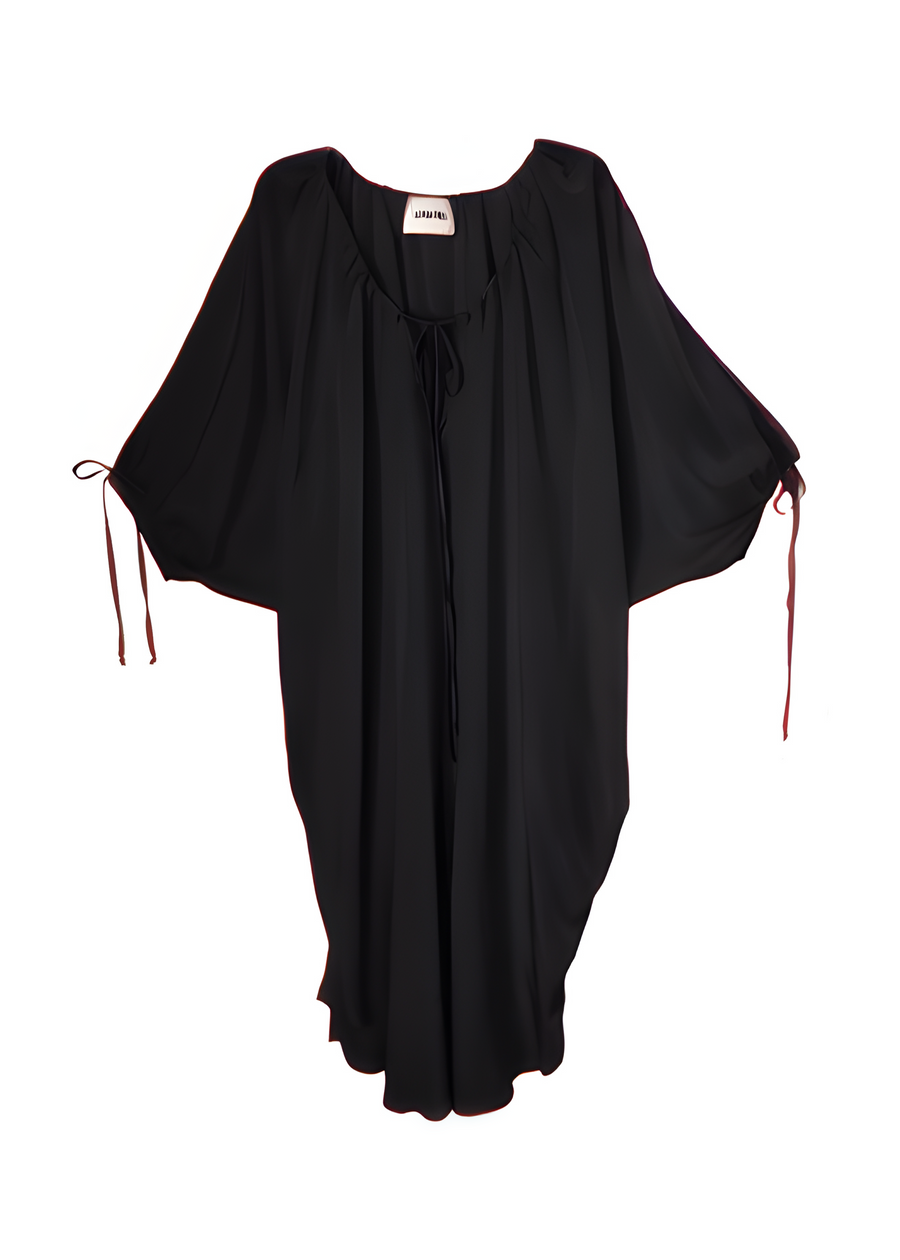 Studio flat lay product display of the Baacal Maxine Kaftan in black showing its wide kimono sleeves and drawstring neckline.