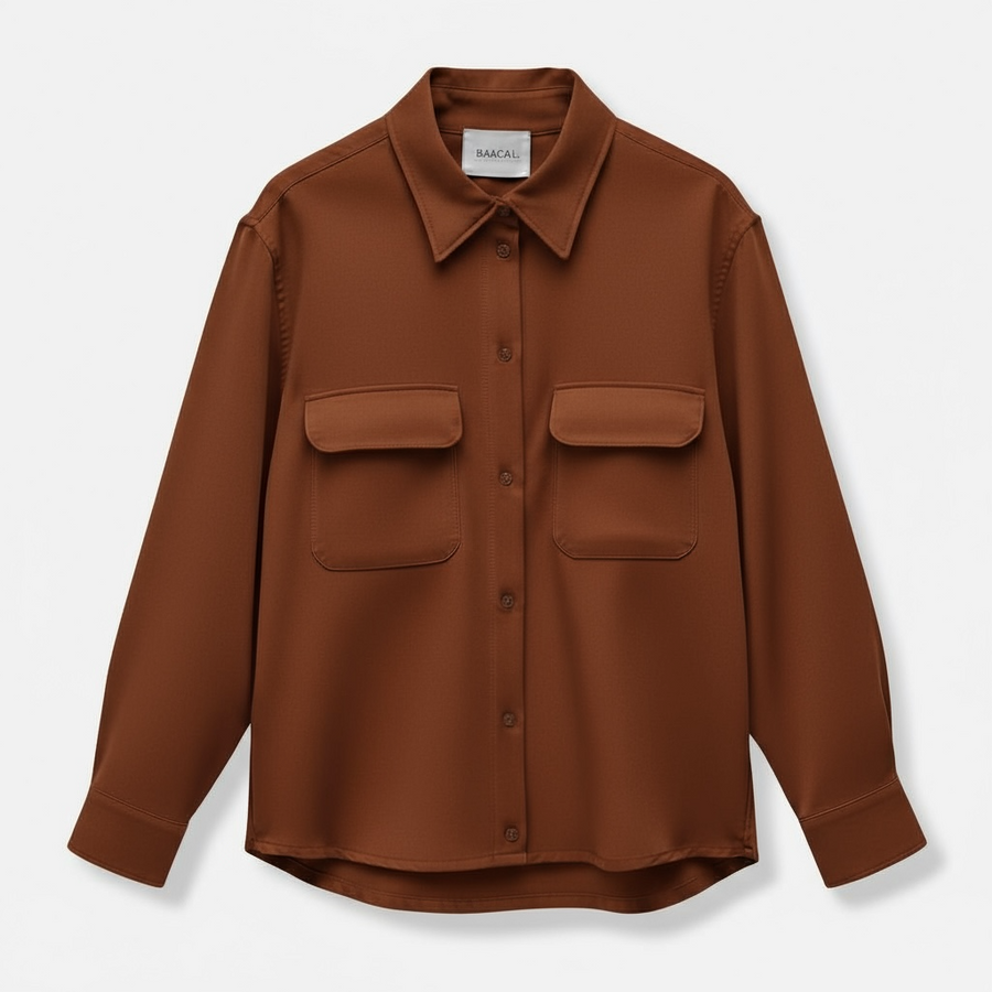 Studio flat lay shot of the Baacal Payton Shirt Jacket in terracotta brown showing chest flap pockets, collar, and front button closure on a light grey background.