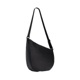 Front studio shot displaying the asymmetrical slouchy silhouette of the black STATE Bags Luna Crossbody.
