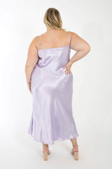 Rear view of a model showing the back fit and adjustable spaghetti straps of the lavender purple bamboo slip dress.