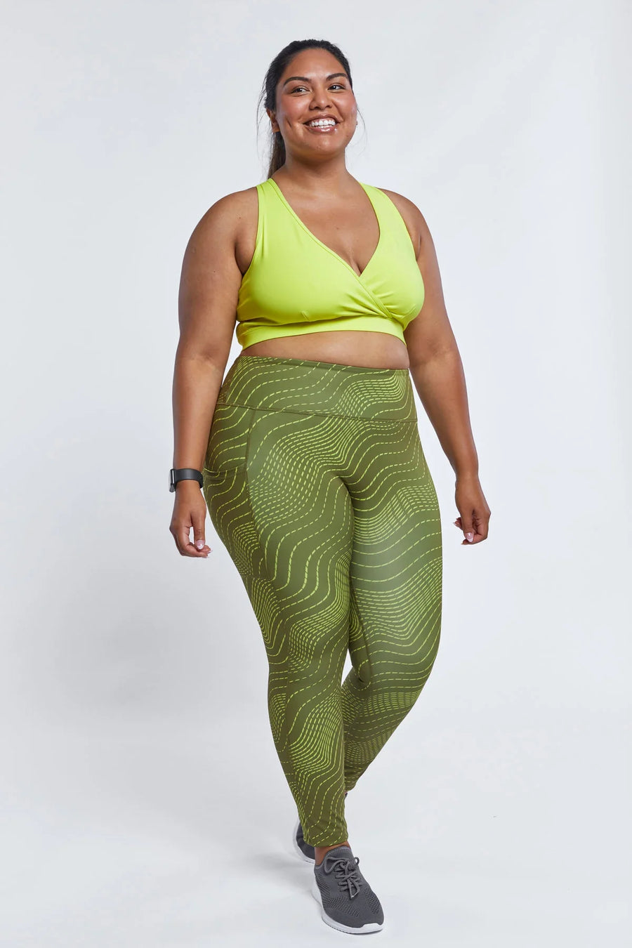 TomboyX Streamline 7/8 Legging Embrace the Curve green wavy print front full body view on plus size model