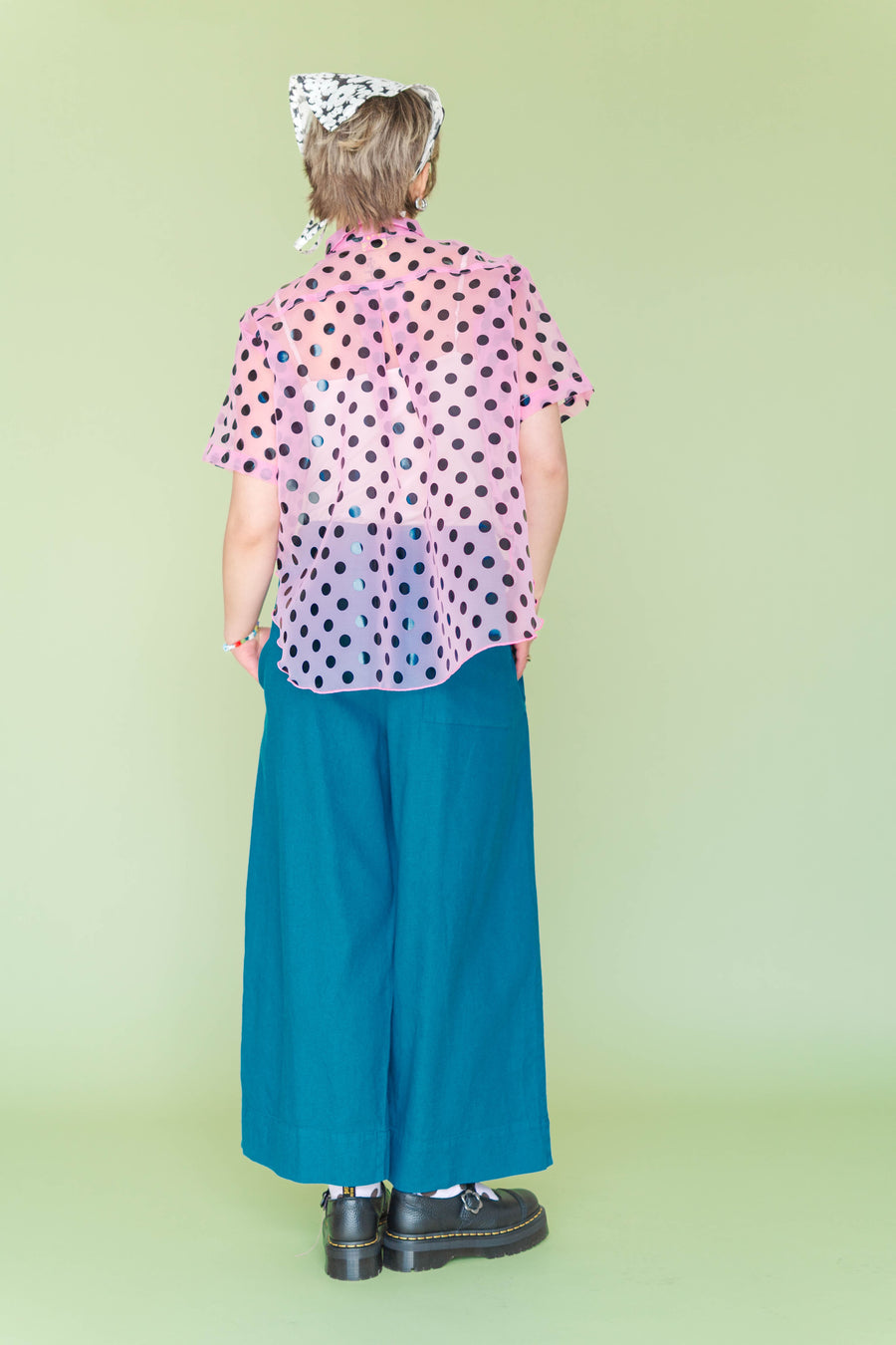 Rear view showing the smooth back rise, relaxed drape, and hem construction of the Nettle Studios Teal Mid Easy Pant.