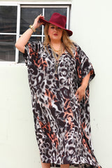 Three-quarter front portrait showing the fluid drape and silk luster of the Sante Grace The Muse Italian Silk Caftan.