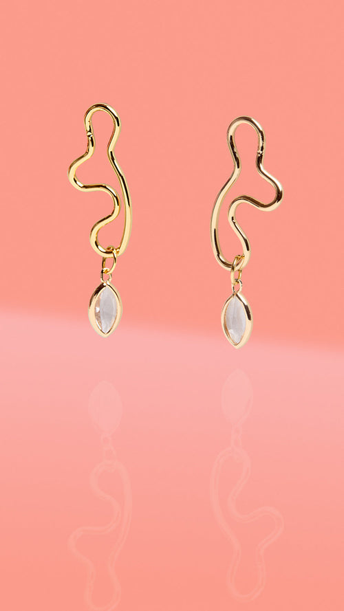 ribe + Temple gold abstract wiggle hoop earrings with clear glass charm drop.