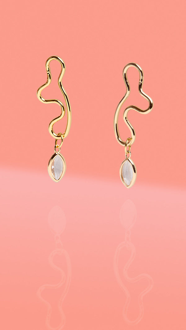 ribe + Temple gold abstract wiggle hoop earrings with clear glass charm drop.