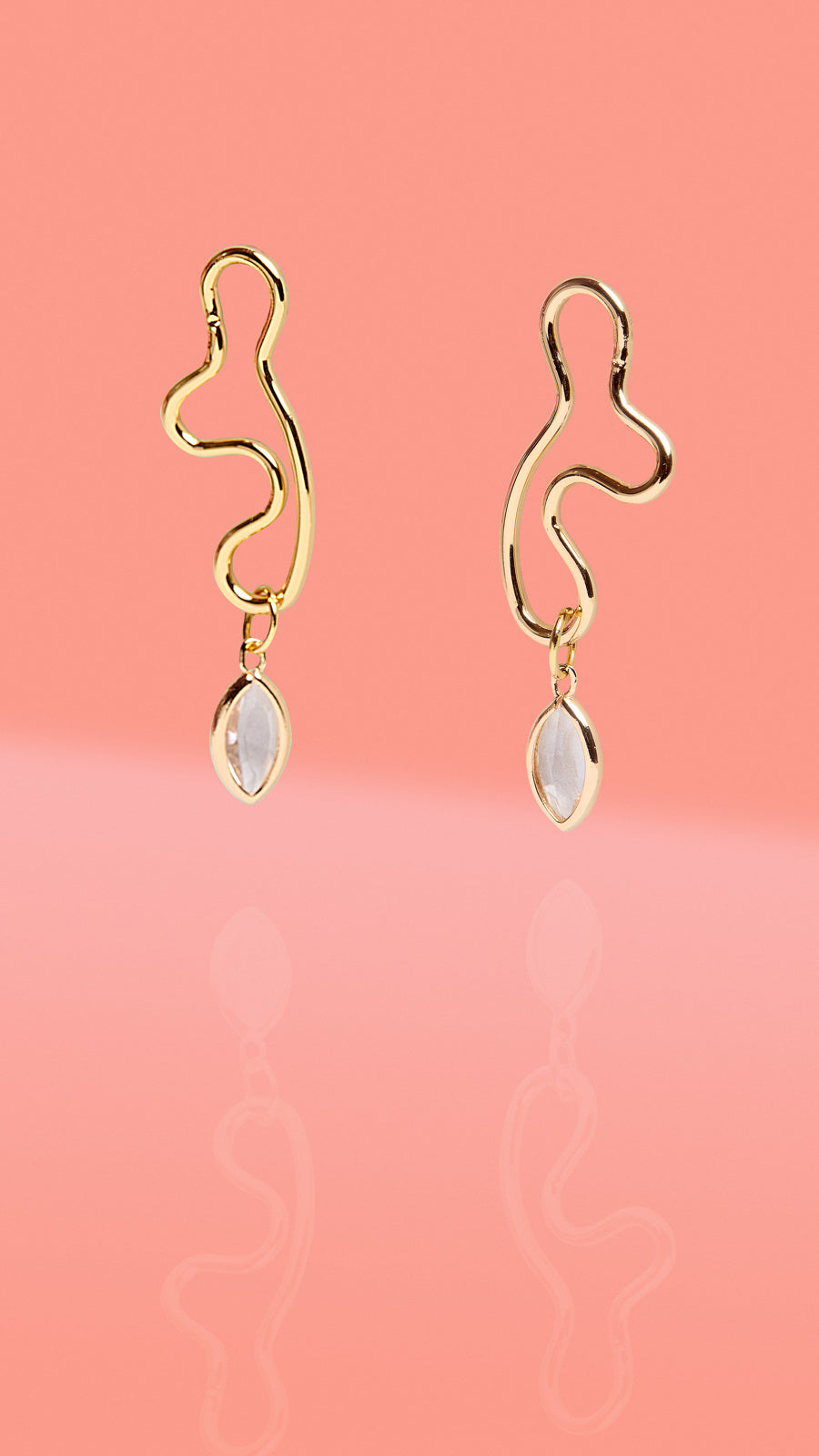 ribe + Temple gold abstract wiggle hoop earrings with clear glass charm drop.