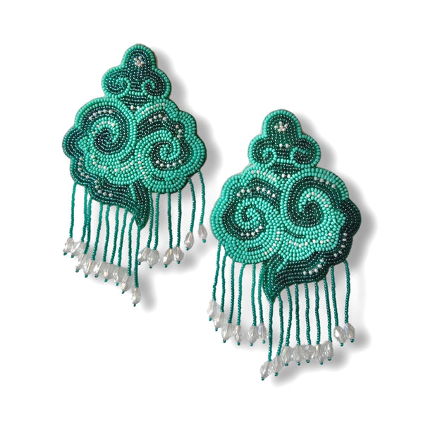 Pair of Fyoli Fyoli Aqua CLOUD hand-embroidered glass bead statement earrings with cascading beaded raindrop fringe on a white background