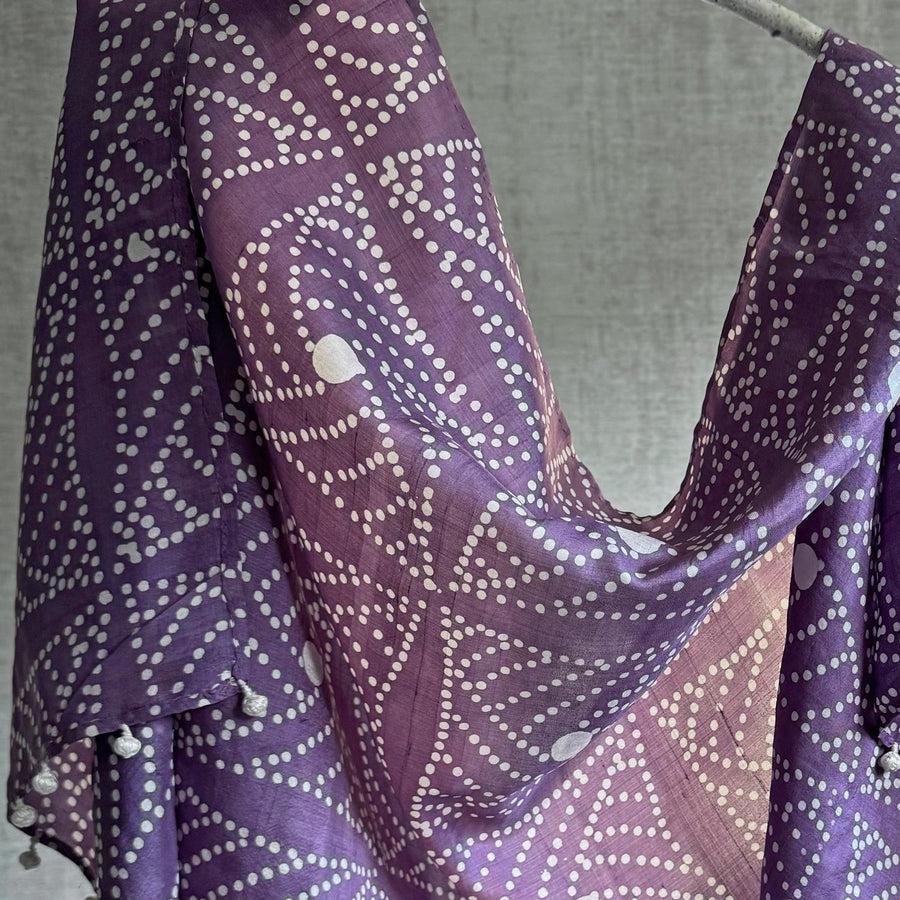 Detailed close-up shot of the draped Fyoli Fyoli DEWBERRY Mulberry Silk Scarf against a neutral gray background, emphasizing the premium texture of the indigenous West Bengal silk weave and the precision of the traditional Indian batik wax-resist print.