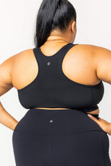 Back view showing the racerback design and supportive wide band of the black Superfit Hero SuperHold sports bra.