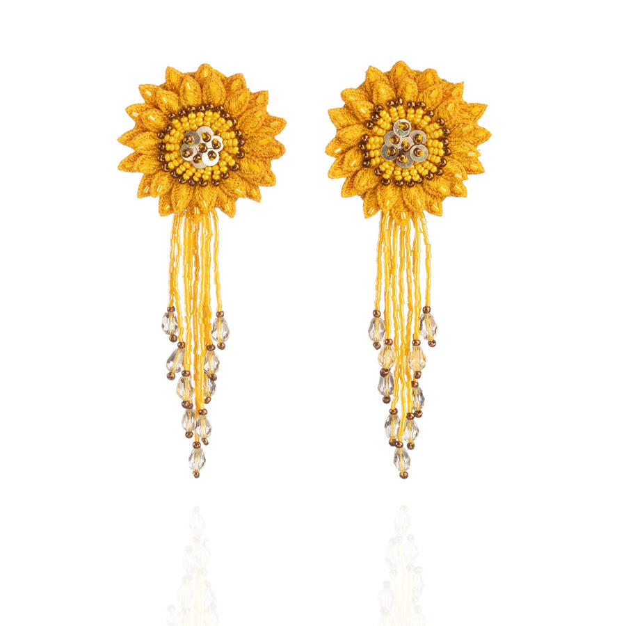 Front view of the Fyoli Fyoli DAHLIA Embroidered Earrings in Sunflower Yellow on a white background. The earrings feature a highly detailed 3D flower top with copper brown accents and a long, matching yellow and clear glass bead fringe.