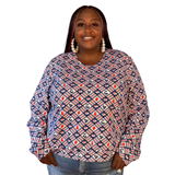  Plus-size model smiling while wearing the size-inclusive Blue Platypus Fruit Picnic Pullover in Blueberry.