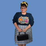 Full front view of a model in the Wacky Owls Midnight Blue cropped sweatshirt carrying a black vintage handbag.