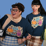 Two models wearing the Blue Platypus Wacky Owls Pullover in Midnight Blue in different sizes side by side.