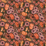 Seamless swatch pattern showing the detailed autumn print with smiling pumpkins and pink/orange flowers on a brown background.