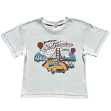 Front product flat lay of the off-white Greetings from SF Baby Tee featuring Golden Gate Bridge artwork and red contrast stitching