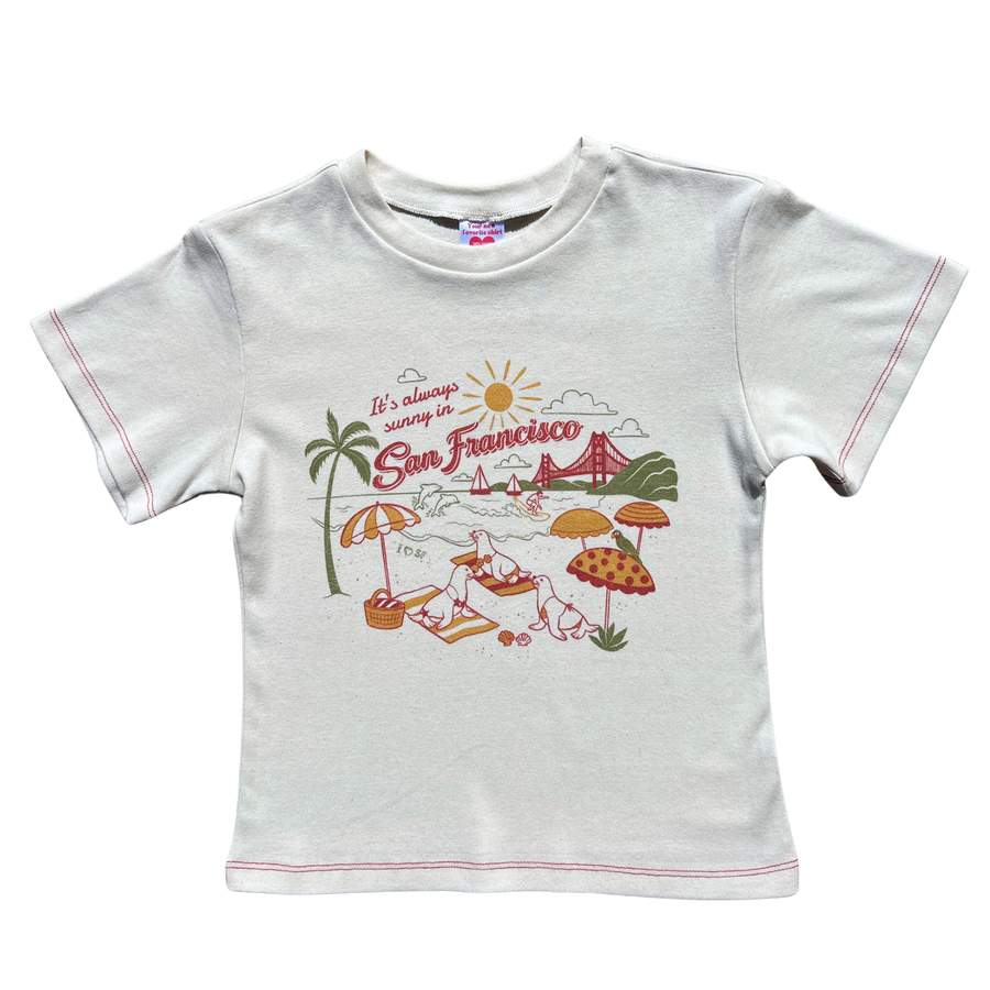 Front view of the off-white Fruit Face It's Always Sunny in SF Baby Tee with San Francisco illustration and red contrast stitching