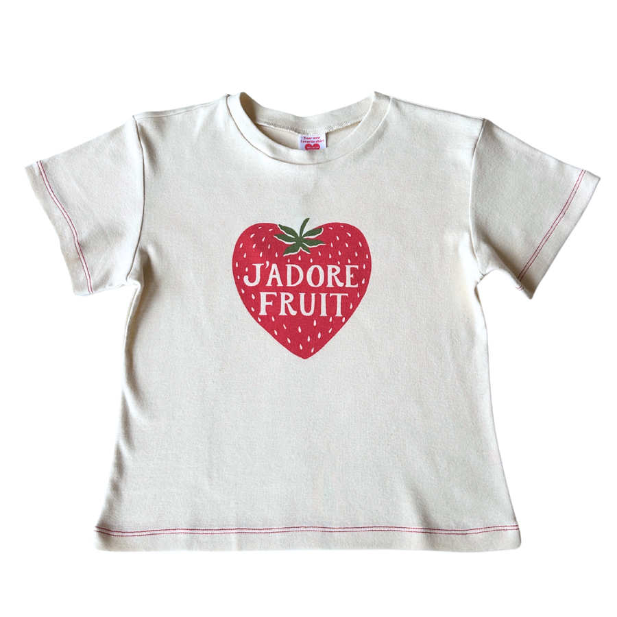 Front flat lay view of the Fruit Face J'Adore Fruit Baby Tee featuring a strawberry heart graphic with red contrast stitching.