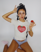 Close-up shot of model Dorothy wearing the Fruit Face J'Adore Fruit strawberry graphic baby tee.