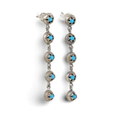 Front view pair of Fyoli Fyoli BEEJ 925 sterling silver seedpod drop earrings set with turquoise glass beads and post backings.